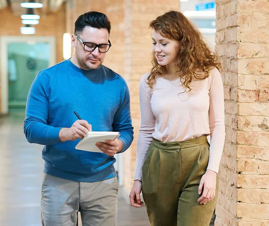 Two People Walking and Talking